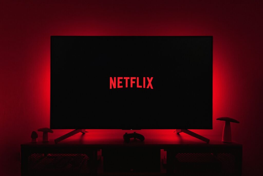 AI powers social media platforms like Netflix. Image shows Netflix screen on TV.